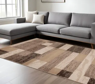 7' X 9' Beige Patchwork Power Loom Stain Resistant Area Rug