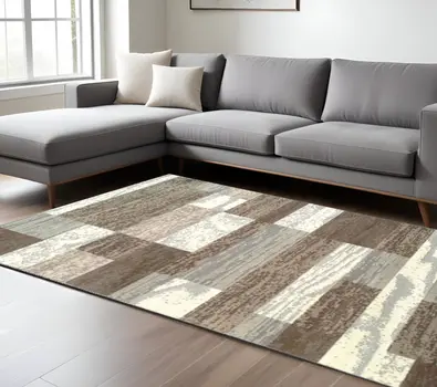 7' X 9' Light Blue And Ivory Patchwork Power Loom Stain Resistant Area Rug