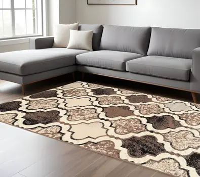 6' X 9' Ivory Quatrefoil Power Loom Distressed Stain Resistant Area Rug