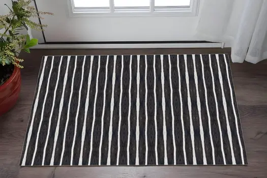 2' X 4' Black And White Modern Stripe Printed Vinyl Area Rug with UV Protection