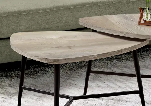 Set of Two 33" Taupe And Black Triangle Nested Coffee Tables