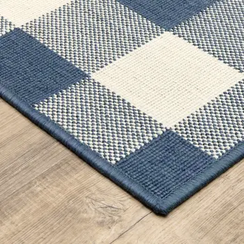 5' X 8' Blue and Ivory Geometric Stain Resistant Indoor Outdoor Area Rug
