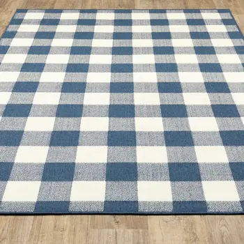 5' X 8' Blue and Ivory Geometric Stain Resistant Indoor Outdoor Area Rug