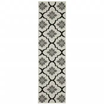 2' X 7' Beige and Black Geometric Stain Resistant Indoor Outdoor Area Rug