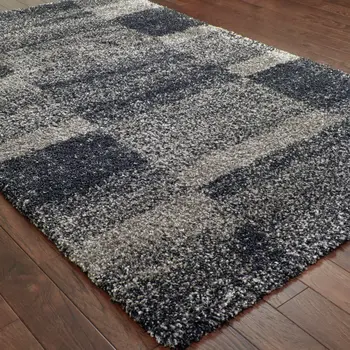 10' X 13' Charcoal Silver And Grey Geometric Shag Power Loom Stain Resistant Area Rug