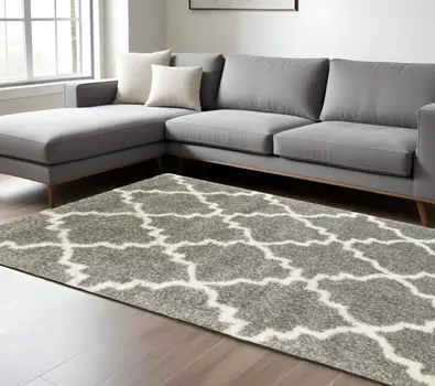 6' X 9' Grey And Ivory Geometric Shag Power Loom Stain Resistant Area Rug