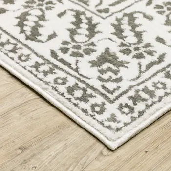 7' X 10' Gray And White Floral Distressed Area Rug
