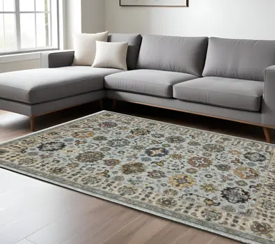 10' X 13' Blue Beige Grey Green Yellow And Rust Oriental Power Loom Stain Resistant Area Rug With Fringe