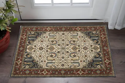 3' X 5' Ivory Beige Red Blue Gold Green And Navy Oriental Power Loom Stain Resistant Area Rug With Fringe