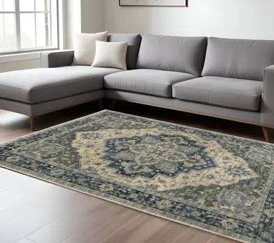 10' X 13' Blue Grey Beige Tan Green And Gold Oriental Power Loom Stain Resistant Area Rug With Fringe