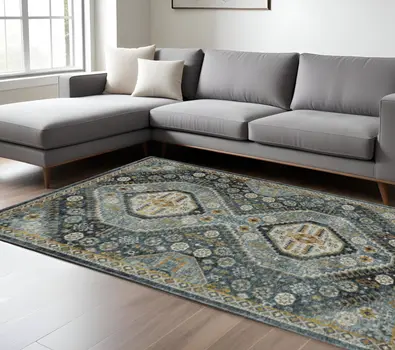 10' X 13' Blue Gold Ivory And Navy Oriental Power Loom Stain Resistant Area Rug With Fringe