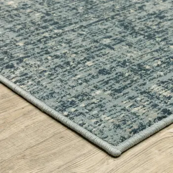 5' X 7' Dark Blue Light Blue Grey Ivory And Beige Abstract Power Loom Stain Resistant Area Rug