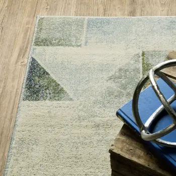 7' X 9' Gray And Ivory Geometric Area Rug