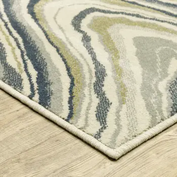 7' X 9' Ivory And Blue Abstract Area Rug