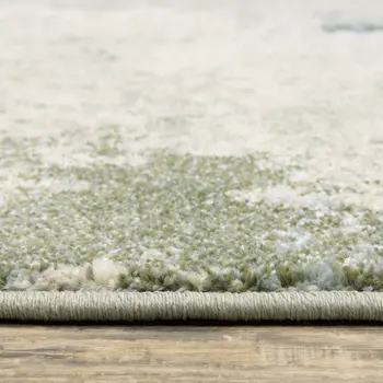 7' X 9' Green And Ivory Abstract Area Rug