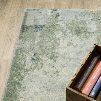 7' X 9' Green And Ivory Abstract Area Rug
