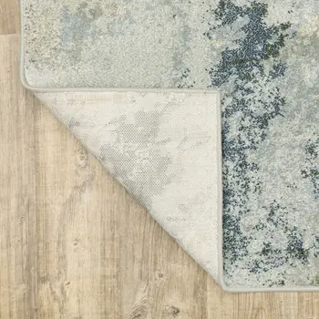 7' X 9' Green And Ivory Abstract Area Rug