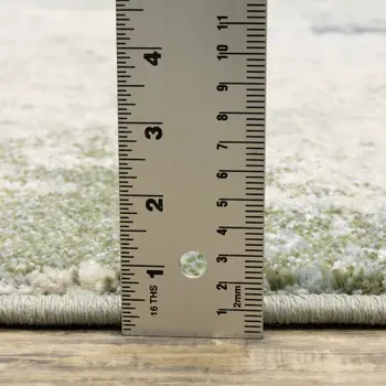 7' X 9' Green And Ivory Abstract Area Rug