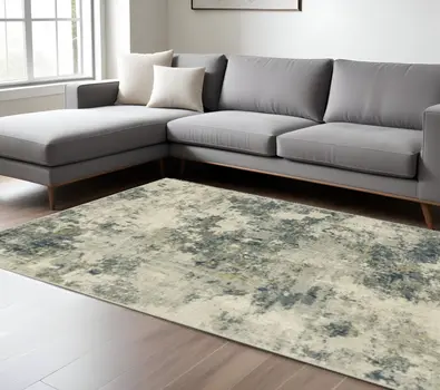 10' X 13' Beige Teal Grey And Gold Abstract Power Loom Stain Resistant Area Rug