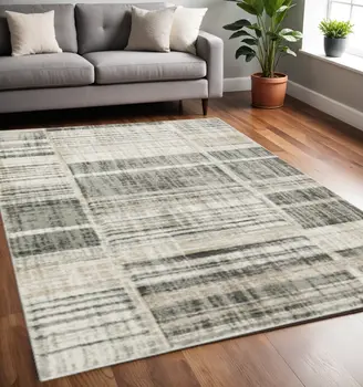 5' X 8' Grey Charcoal Ivory Tan Brown And Beige Geometric Power Loom Stain Resistant Area Rug