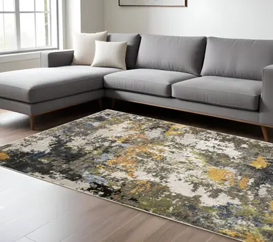 7' X 10' Beige Green And Orange Abstract Area Rug