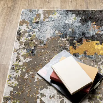 7' X 10' Beige Green And Orange Abstract Area Rug