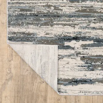5' X 8' Blue Grey Beige And Brown Abstract Power Loom Stain Resistant Area Rug