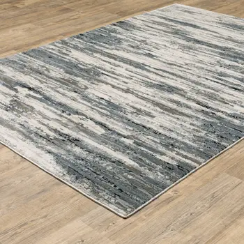 6' X 9' Blue Grey Beige And Brown Abstract Power Loom Stain Resistant Area Rug