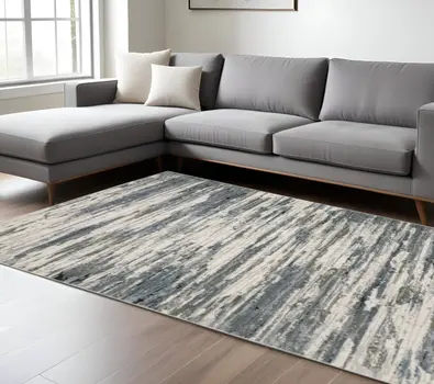 10' X 13' Blue Grey Beige And Brown Abstract Power Loom Stain Resistant Area Rug