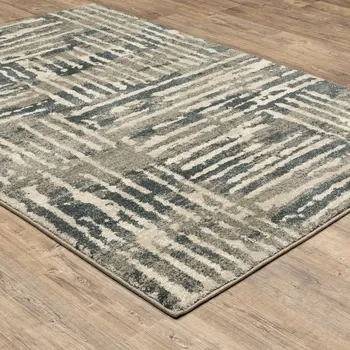 5' X 7' Blue And Beige Abstract Power Loom Stain Resistant Area Rug