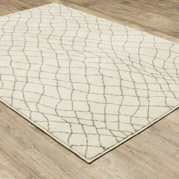 7' X 9' Gray And Ivory Geometric Shag Area Rug
