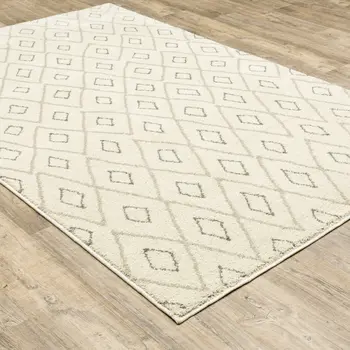 7' X 9' Gray And Ivory Geometric Shag Area Rug