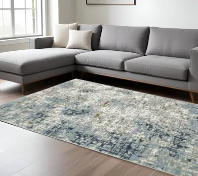 6' X 9' Blue Ivory Grey Brown Beige And Light Blue Abstract Power Loom Stain Resistant Area Rug