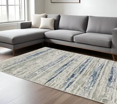 10' X 13' Blue Ivory Grey Light Blue And Brown Abstract Power Loom Stain Resistant Area Rug