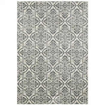 10' X 13' Ivory Blue And Sage Floral Power Loom Stain Resistant Area Rug