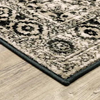 4' X 6' Black Grey Tan And Ivory Oriental Power Loom Stain Resistant Area Rug