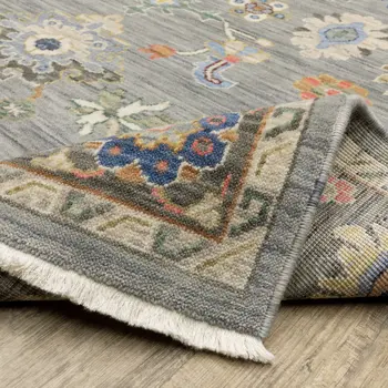 6' X 9' Blue Grey Gold Green Pink Orange Ivory And Red Oriental Power Loom Stain Resistant Area Rug With Fringe
