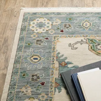 5' X 8' Ivory And Blue Oriental Area Rug With Fringe