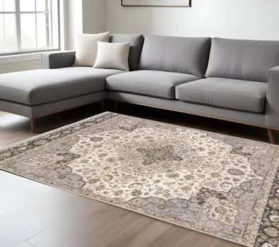 10' X 13' Ivory And Blue Oriental Power Loom Stain Resistant Area Rug With Fringe