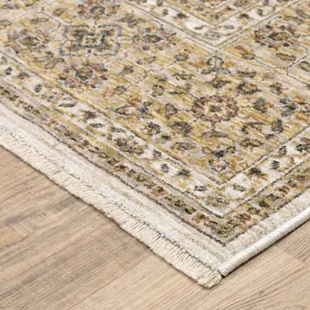 7' X 10' Ivory And Gold Oriental Area Rug With Fringe