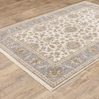 5' X 8' Ivory And Blue Oriental Power Loom Stain Resistant Area Rug With Fringe