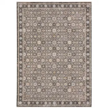 8' X 11' Charcoal Ivory and Beige Floral Power Loom Area Rug With Fringe