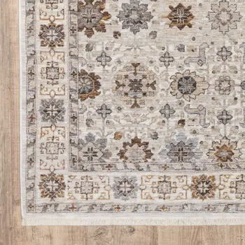 8' X 11' Ivory And Gold Oriental Power Loom Stain Resistant Area Rug With Fringe