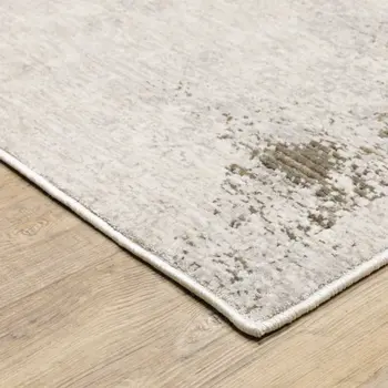 7' X 10' Ivory And Beige Abstract Distressed Area Rug