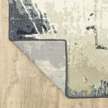 10' X 13' Blue Green And Ivory Abstract Area Rug