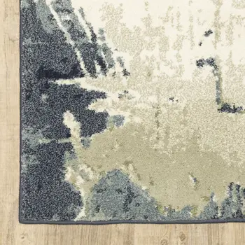 10' X 13' Blue Green And Ivory Abstract Area Rug