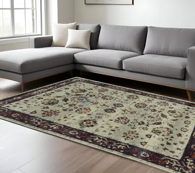 5' X 7' Red and Ivory Oriental Power Loom Area Rug