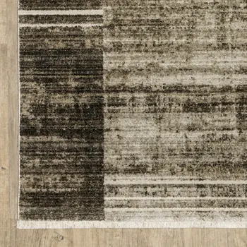 6' X 9' Beige Charcoal Brown Grey Tan Gold And Blue Geometric Power Loom Stain Resistant Area Rug With Fringe