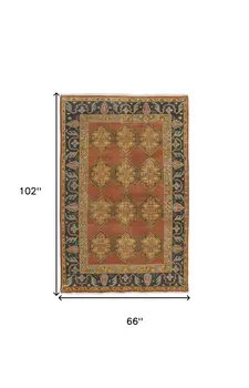 5' X 8' Tan Orange And Brown Wool Floral Hand Knotted Stain Resistant Area Rug