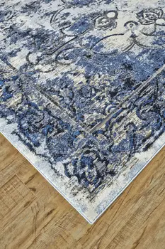 4' X 6' Blue Ivory And Gray Floral Distressed Stain Resistant Area Rug